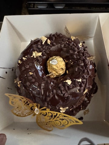 Chocolate bundt with Ferrero Rocher and gold butterflies