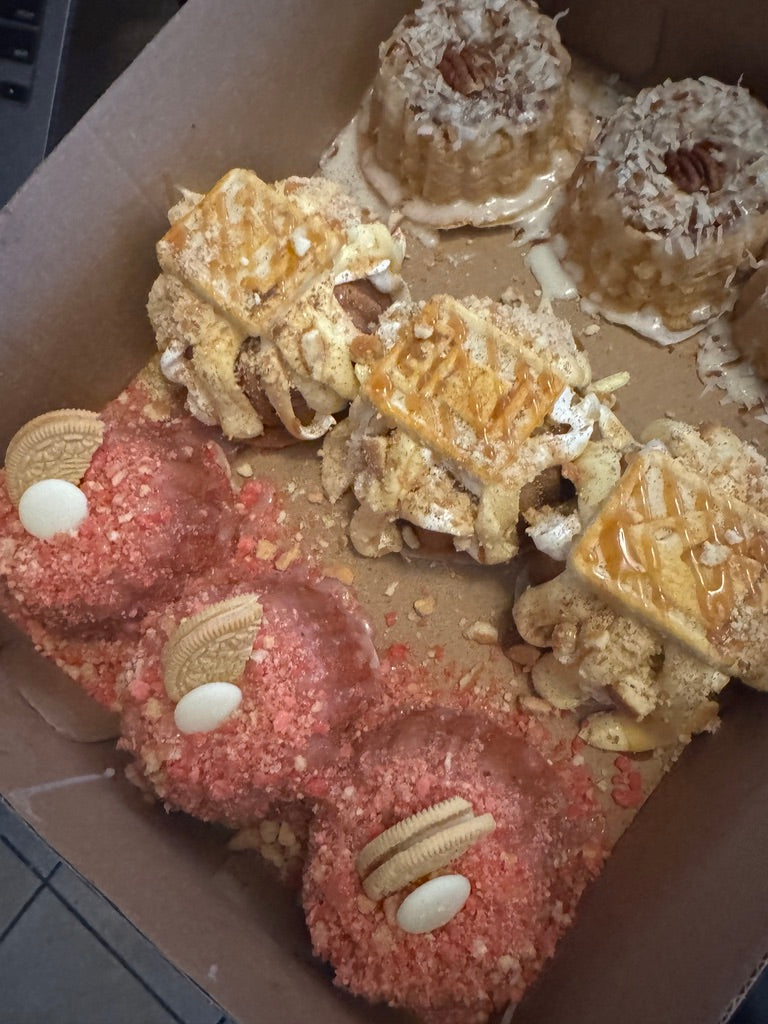 Box of strawberry crunch, banana pudding and coconut mini bundts