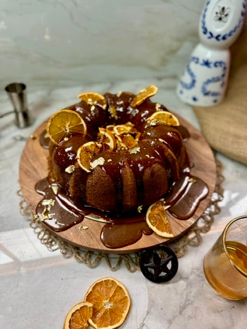 Bourbon bundt with chocolate glaze and dried orange slices